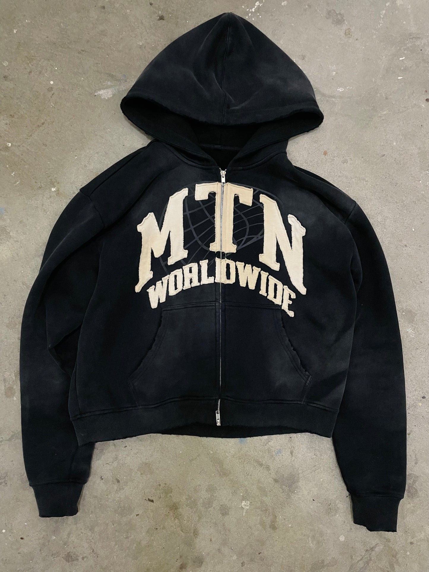 “MTN WRLDWIDE” Black Washed Zip-Up Hoodie